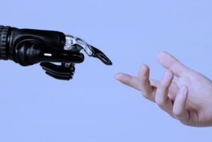 Mano humana extendida hacia una mano robótica, simbolizando la interacción entre humanidad e inteligencia artificial.